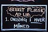 Stegt fl�sk. Skilt reklamerende for stegt fl�sk ad libitum den f�rste onsdag i hver m�ned  Maribo Danmark   k�bst�der, Lolland, mad, restauration, skilte, reklame