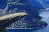 Trolltunga. Fjeldvandrer p� Trolltunga, en klippeformation der stikker ud af klippesiden 700 meter over Ringedalvatnet n�r Hardangervidda National Park  Trolltunga / Tyssedal Norge   Vandring, vandretur, fjeldvandring, turisme, hiking