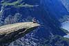 Trolltunga. Fjeldvandrer p� Trolltunga, en klippeformation der stikker ud af klippesiden 700 meter over Ringedalvatnet n�r Hardangervidda National Park  Trolltunga / Tyssedal Norge   Vandring, vandretur, fjeldvandring, turisme, hiking